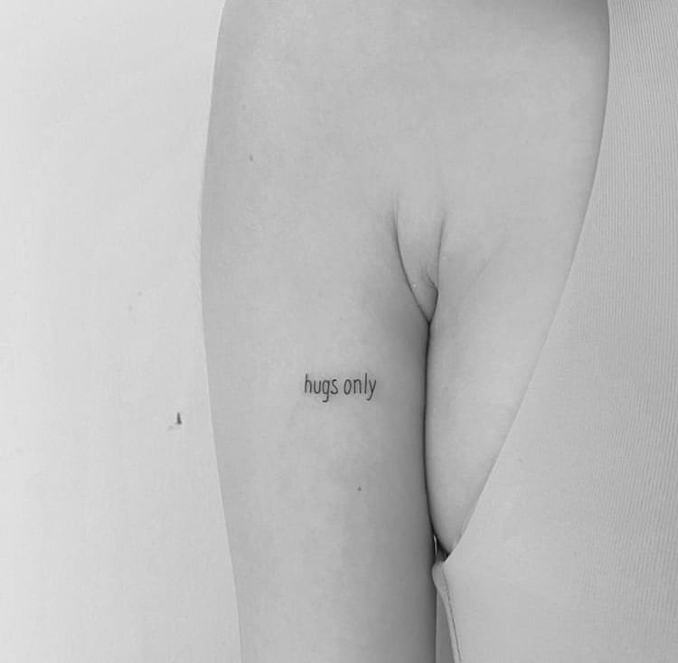 Hugs only lettering minimalist tattoo idea