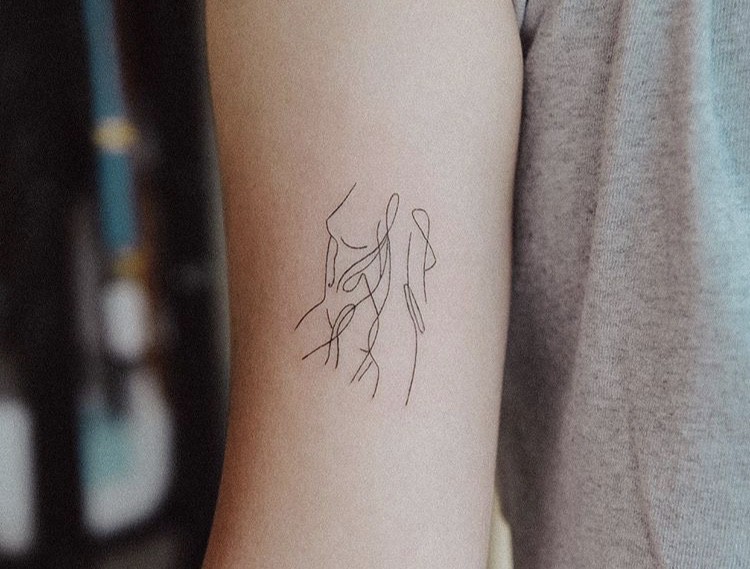 Feminine female shape minimalist tattoo idea