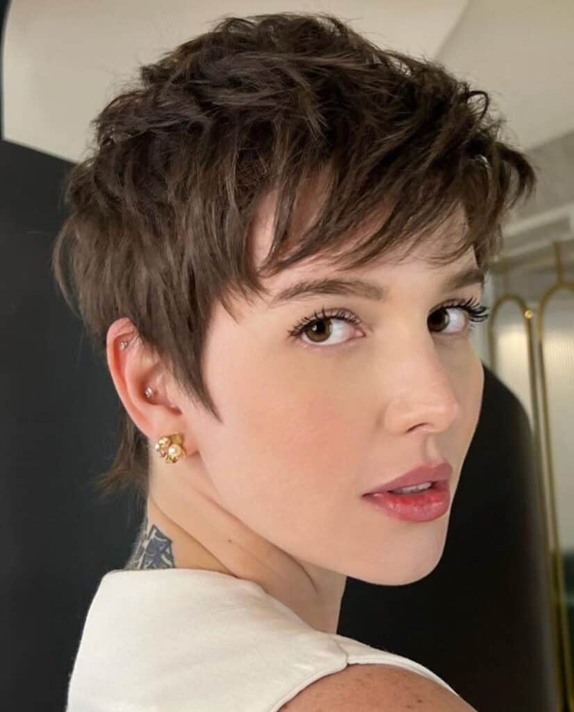 layered pixie with brow grazing bangs