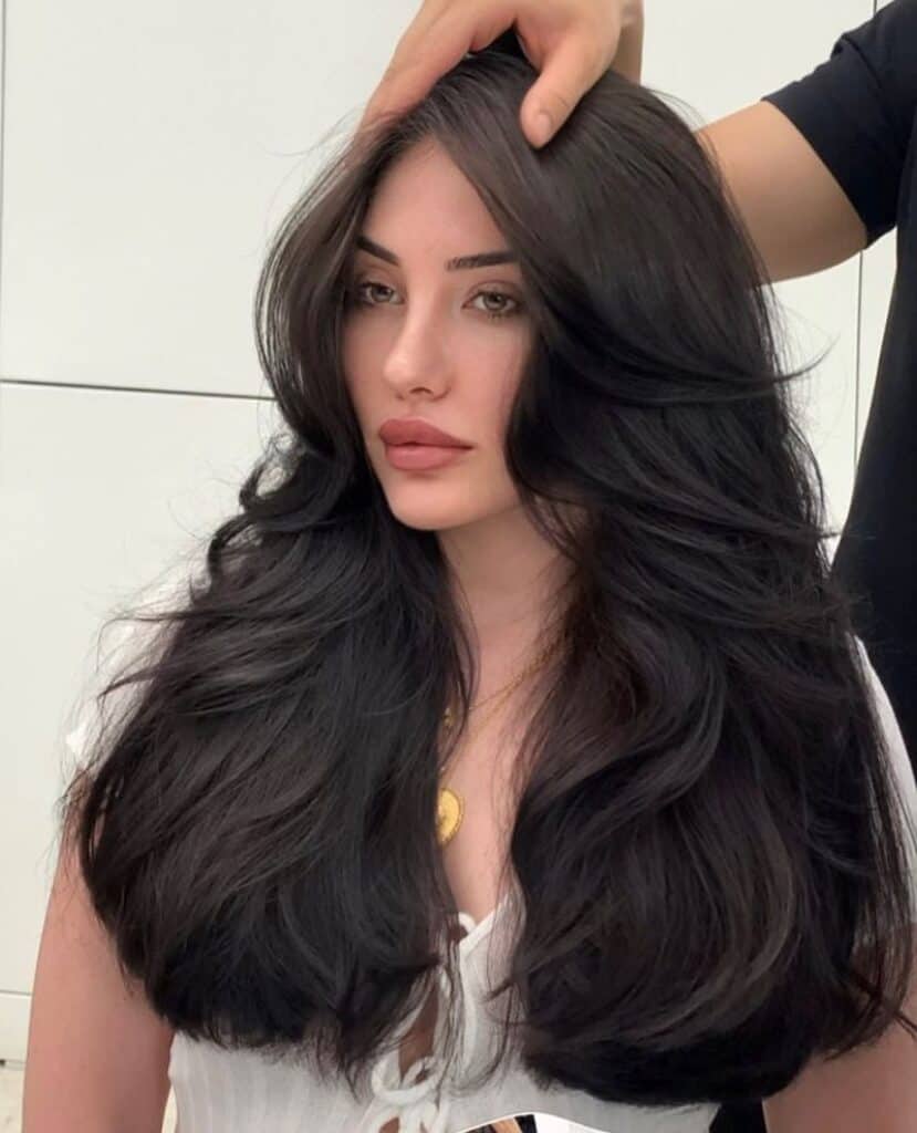 sassy curtain bangs on long jet black hair