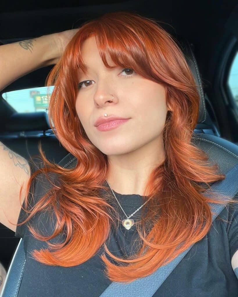 Curtain bangs on copper hair