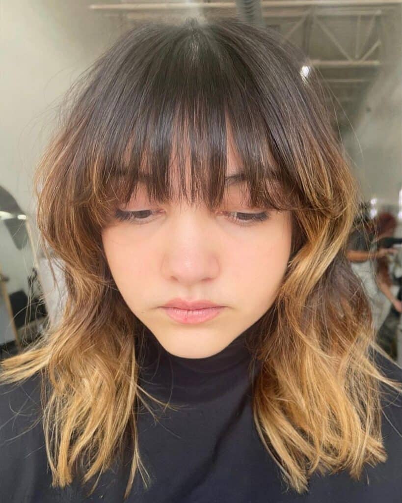 Curtain bangs on a shag cut