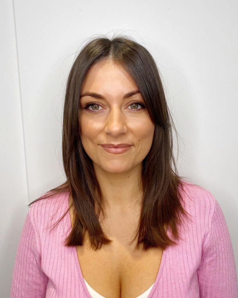 Curtain bangs on straight hair with soft face framing layers 