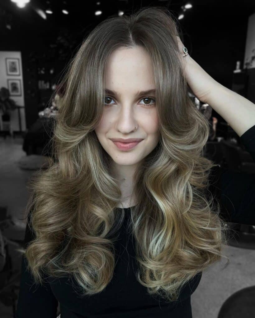 sandy blonde curtain bangs with waves 