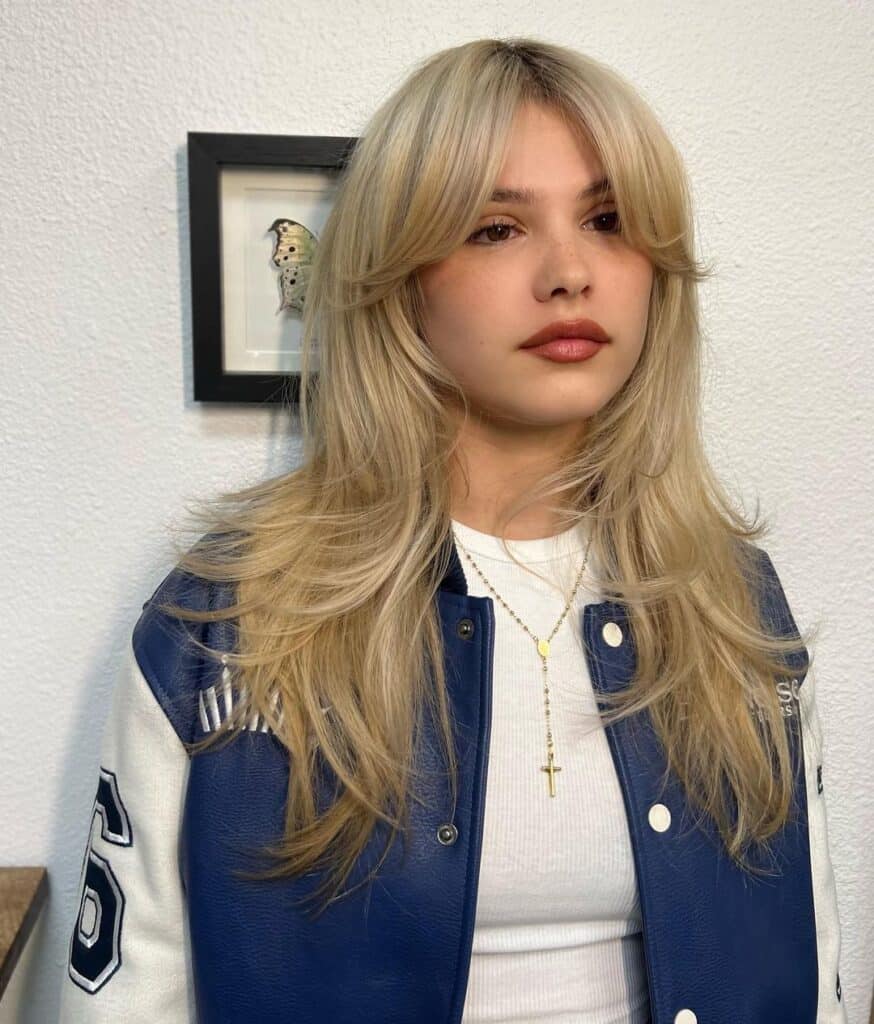 Layered curtain bangs on blonde hair