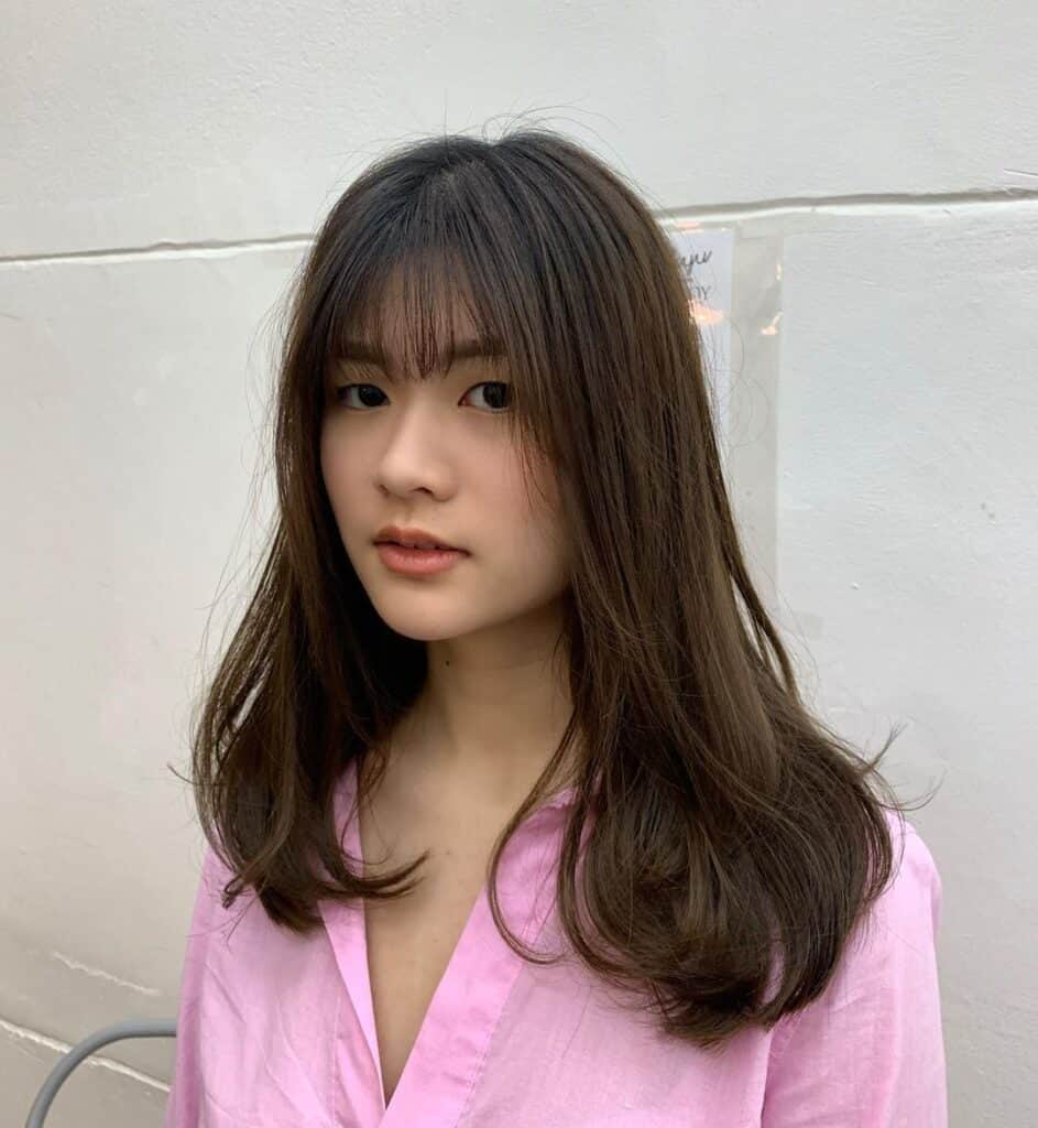 medium haircut hairstyle  with bangs 