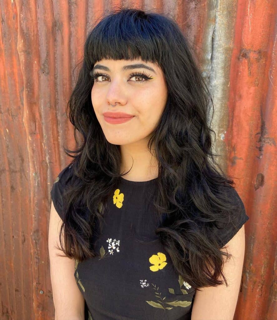 layered hairstyle with straight across bangs