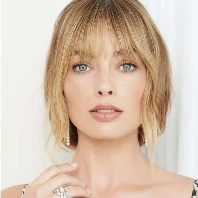 neck length bob with feathered bangs