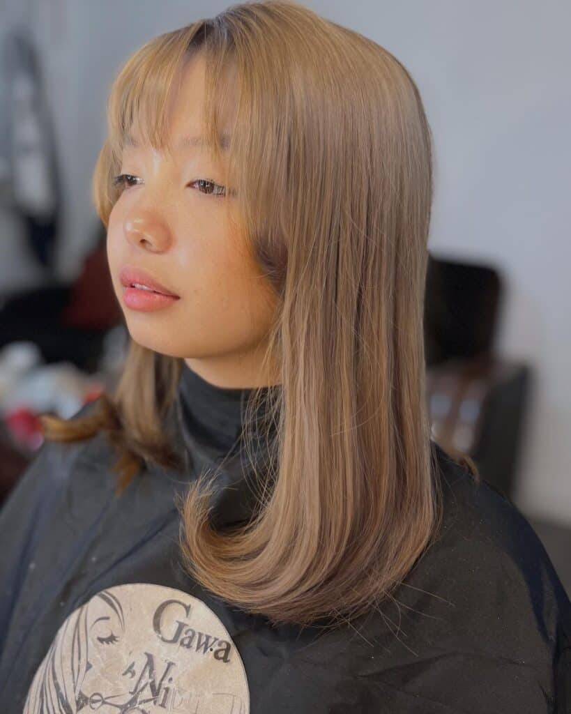 medium haircut with wispy bangs 