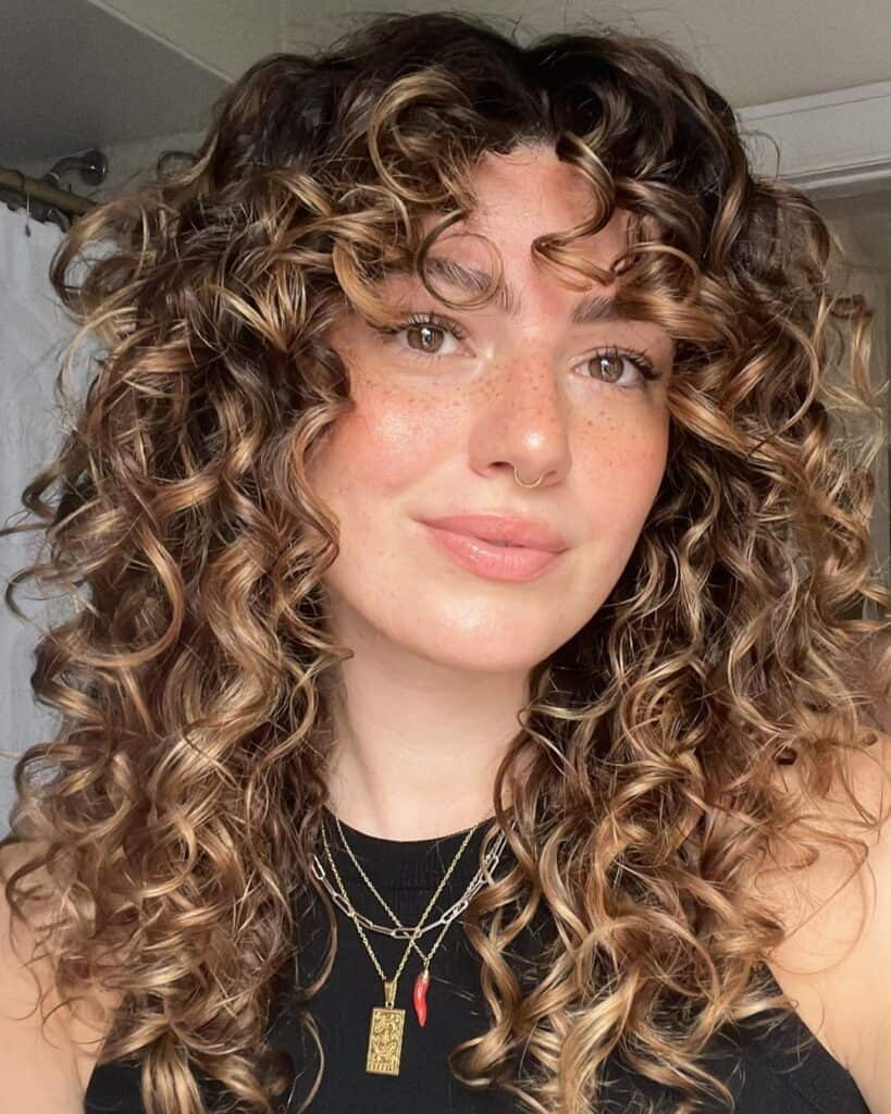 curly hair haircut with bangs 