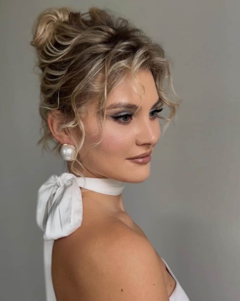 high bun updo with bangs 