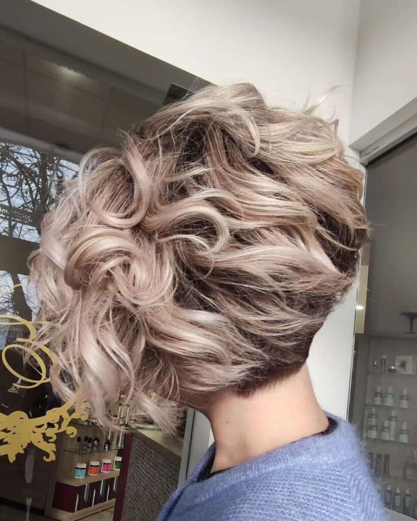 wavy bob with undercut and dark roots