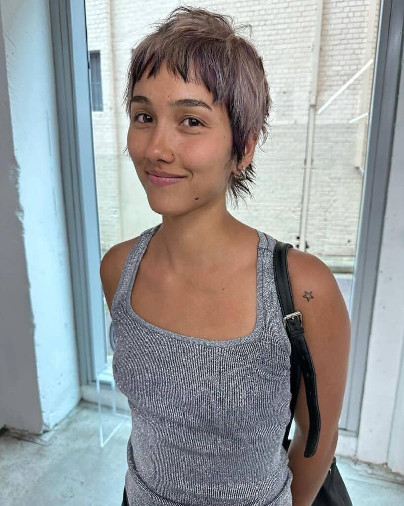 wolf cut hairstyle with bangs 