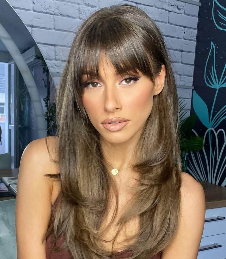 butterfly cut with bottleneck bangs 