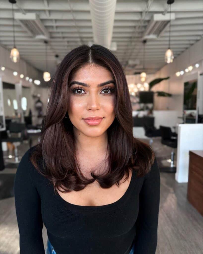 layered cut with face-framing bangs 