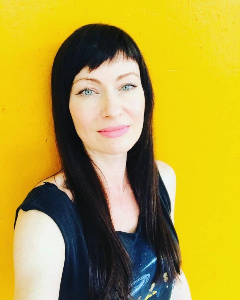 Asymmetrical bangs on long straight hair