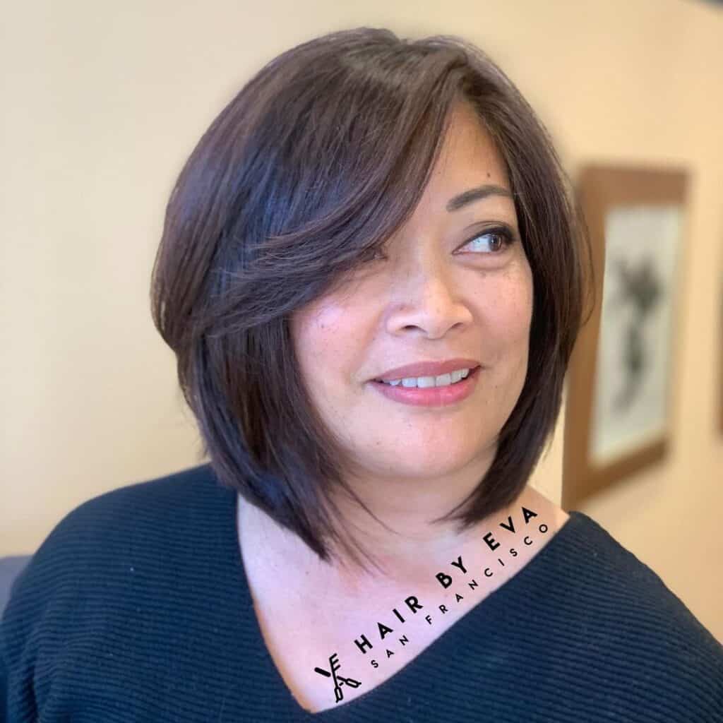 bob cut with side swept curtain bangs