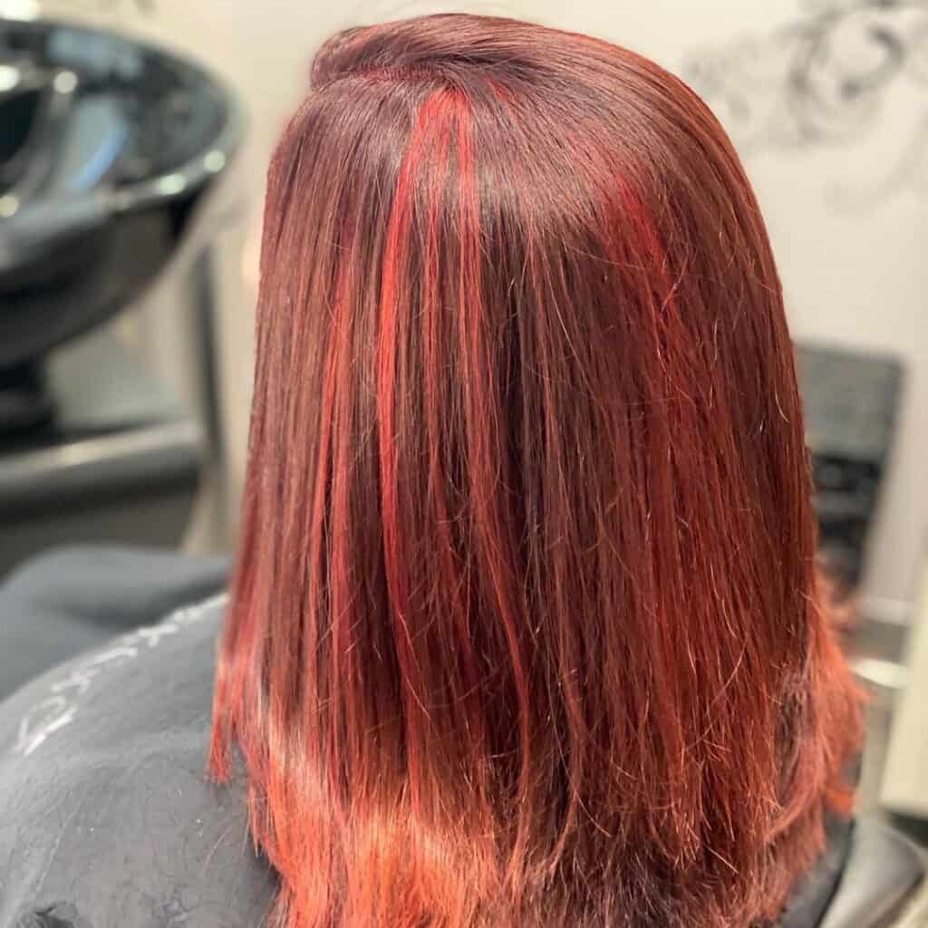 cherry cola hair with red highlights 