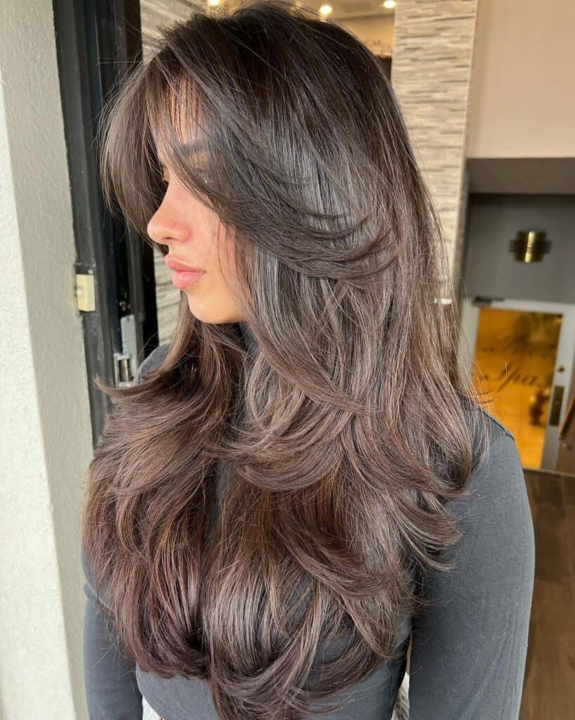 Butterfly cut with face framing layers on long hair