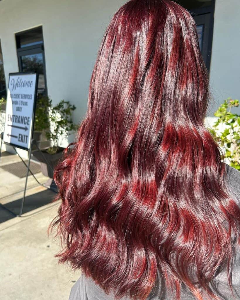 cherry cola color on long hair with waves