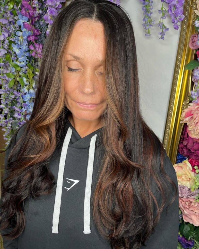 caramel money piece hair with face framing layers on long hair