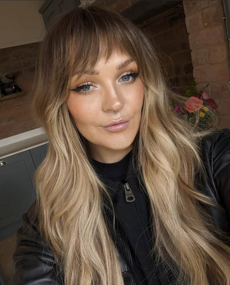 face framing layers on long hair with side swept fringe bangs