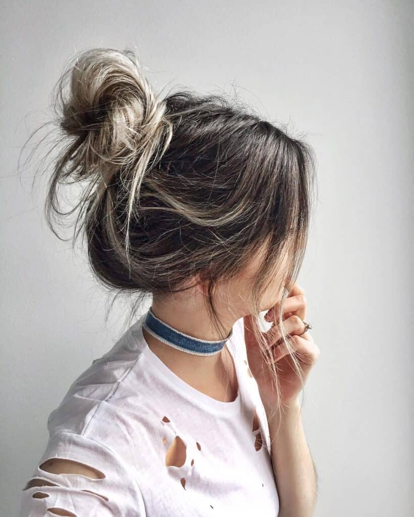 messy top knot bun for thin hair
